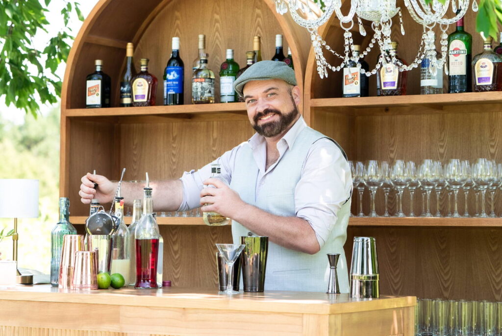 Bartender preparing drinks at the Fermanagh Farms bar